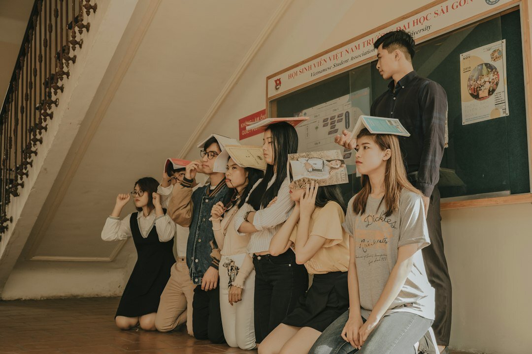 Presenter pointing at a flipchart in front of a small group of colleagues